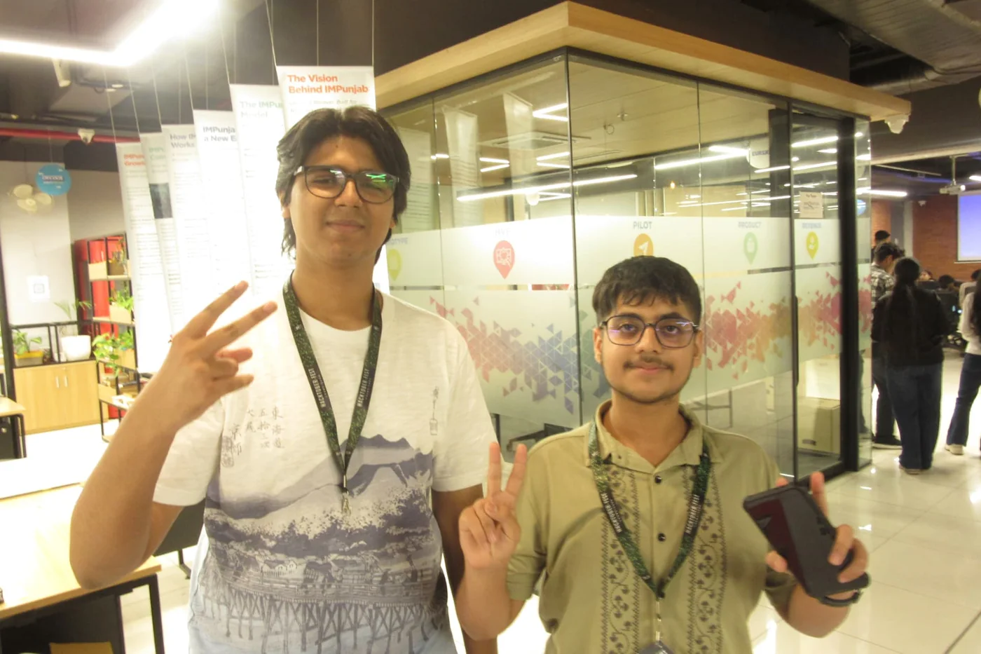 Two hackers posing together at the hackathon
