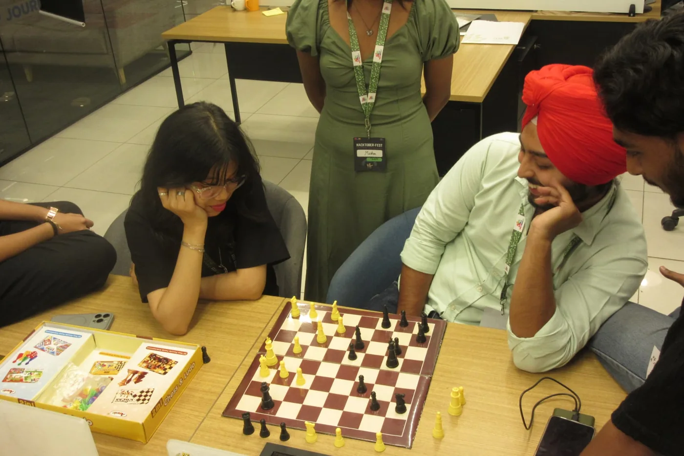 Hackers taking a break over a game of chess